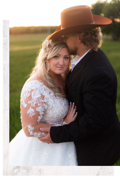 western groom kissing bride on forehead