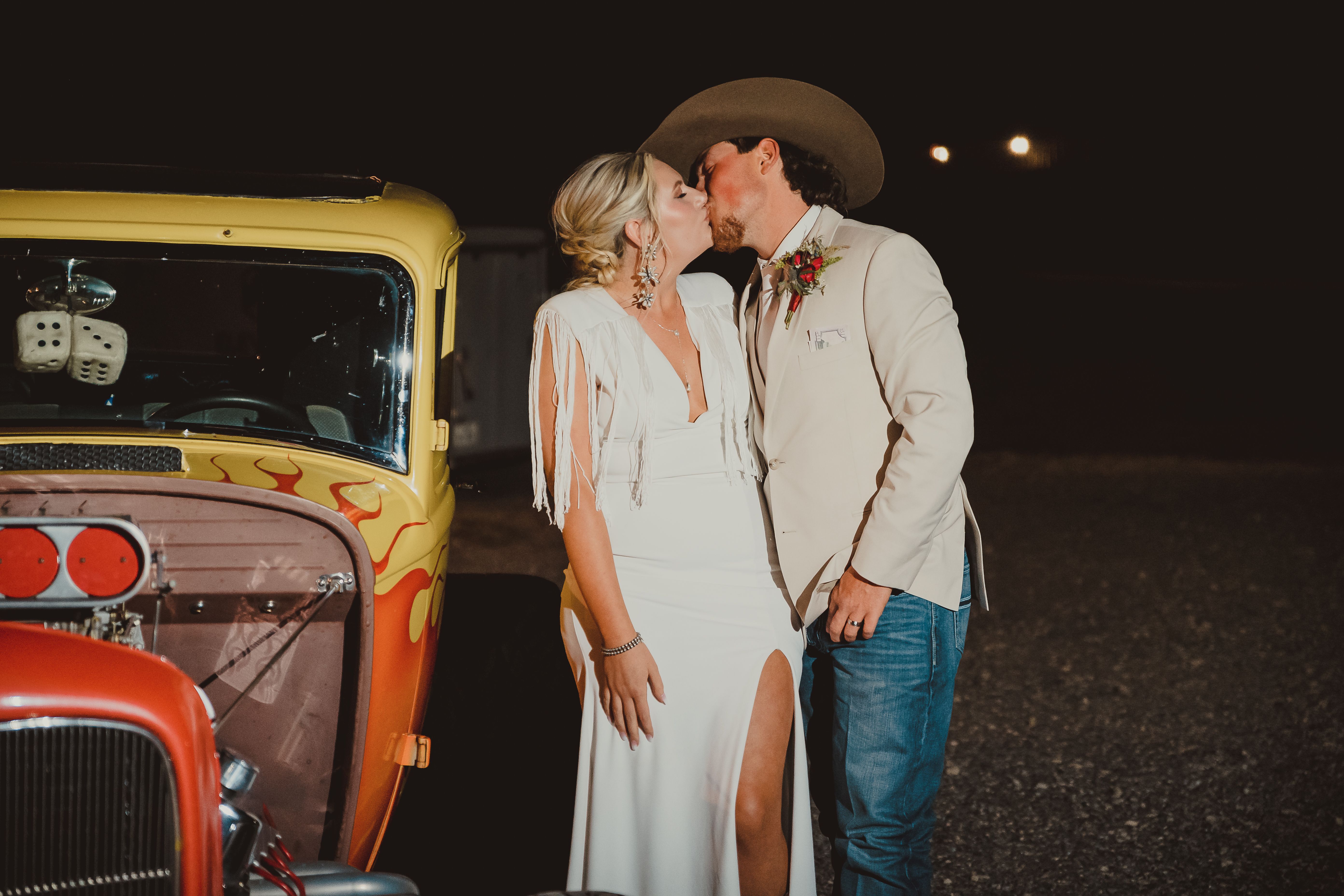 western bride and groom kissing
